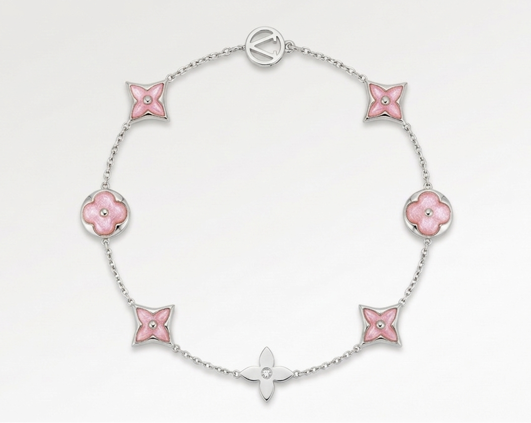 Silver bracelet with pink flower-shaped links on a white background